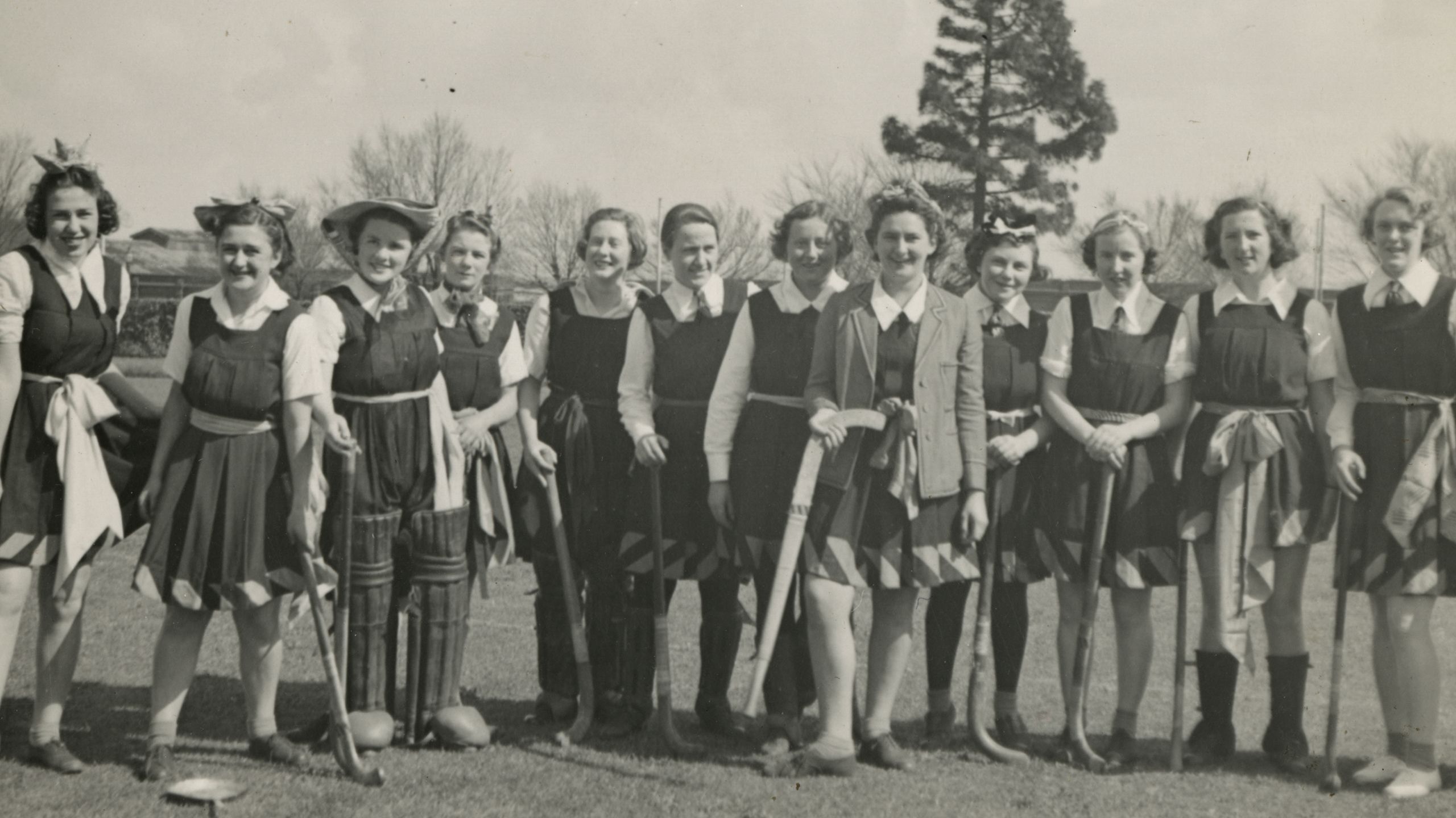 Women students of Janet Clarke Hall prepare for the annual hockey match against the College men, in 1938.