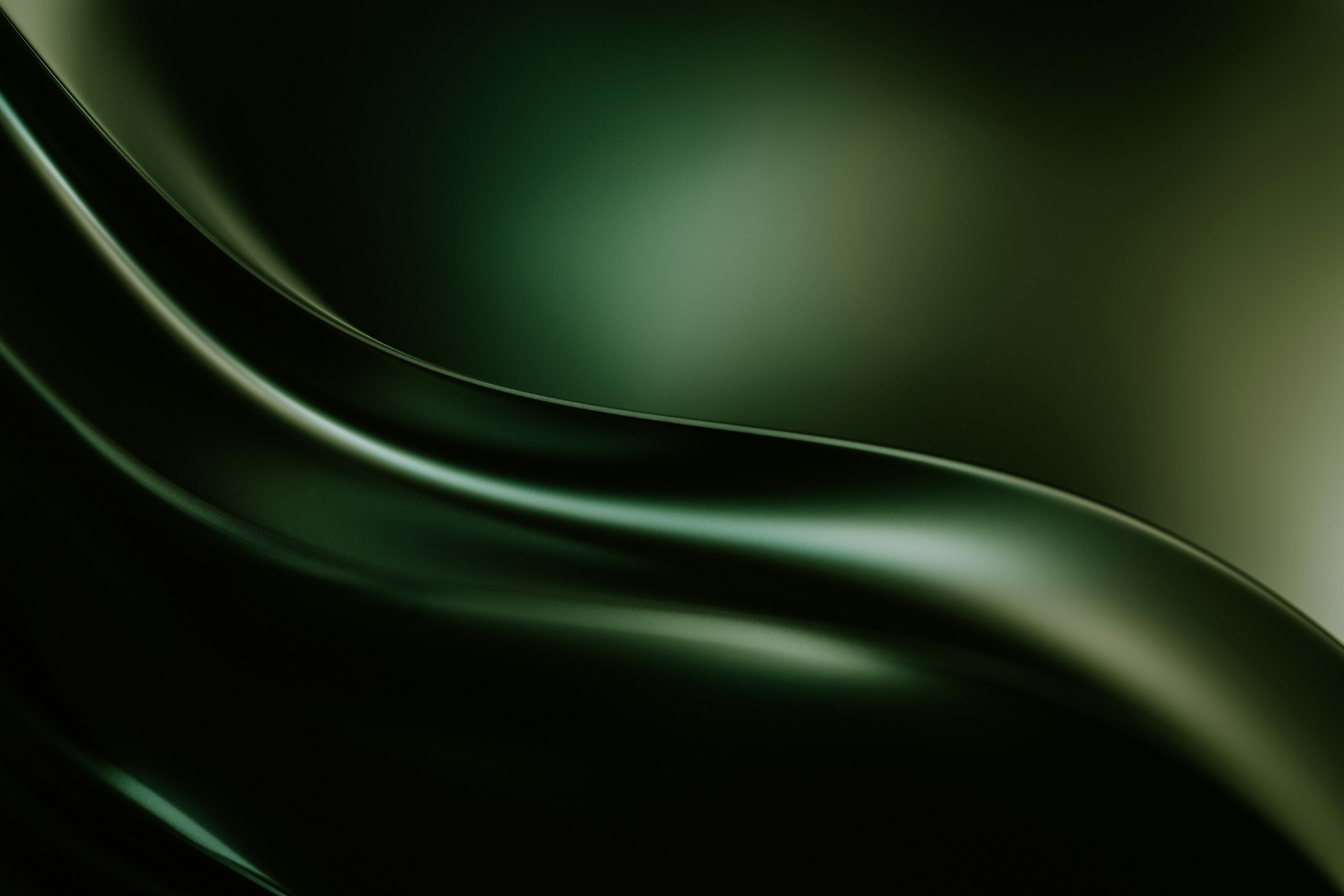 a black and green background with wavy lines