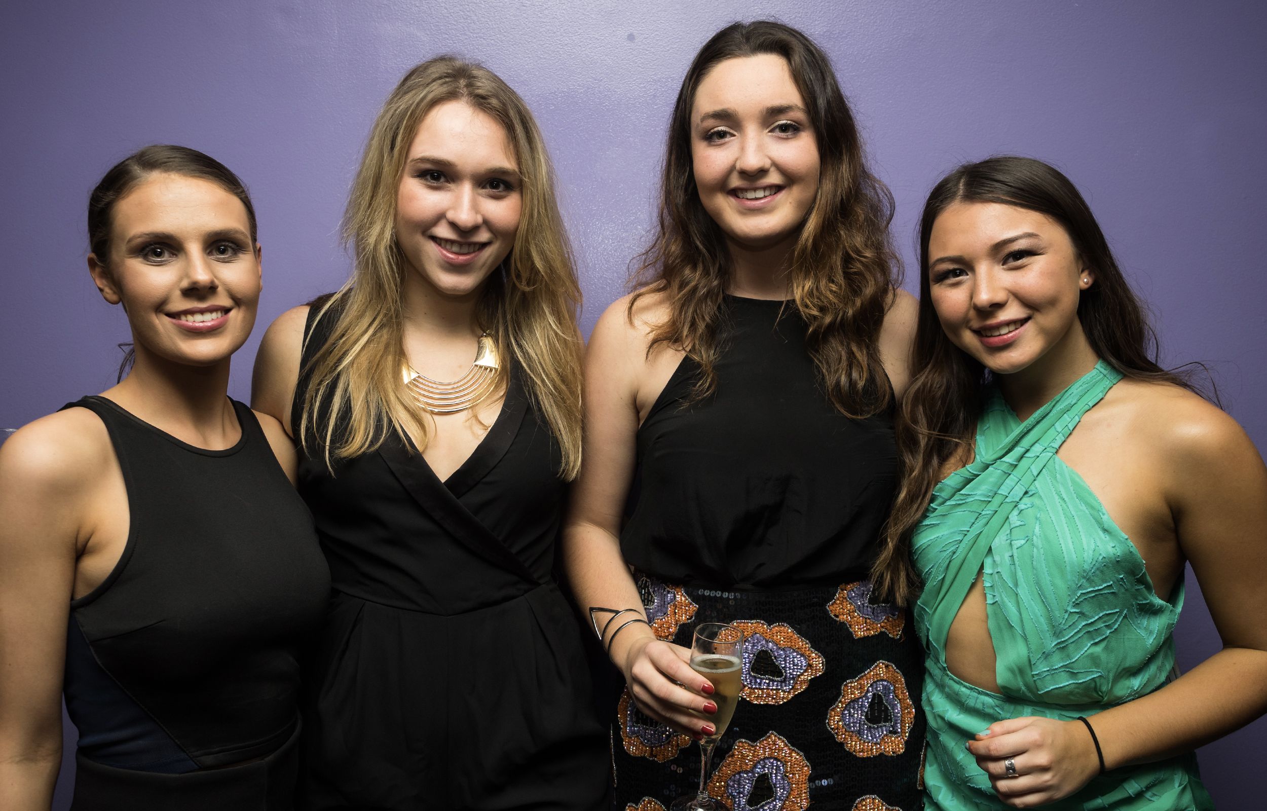 Four female students at the Sports Ball, Trinity College, 2015