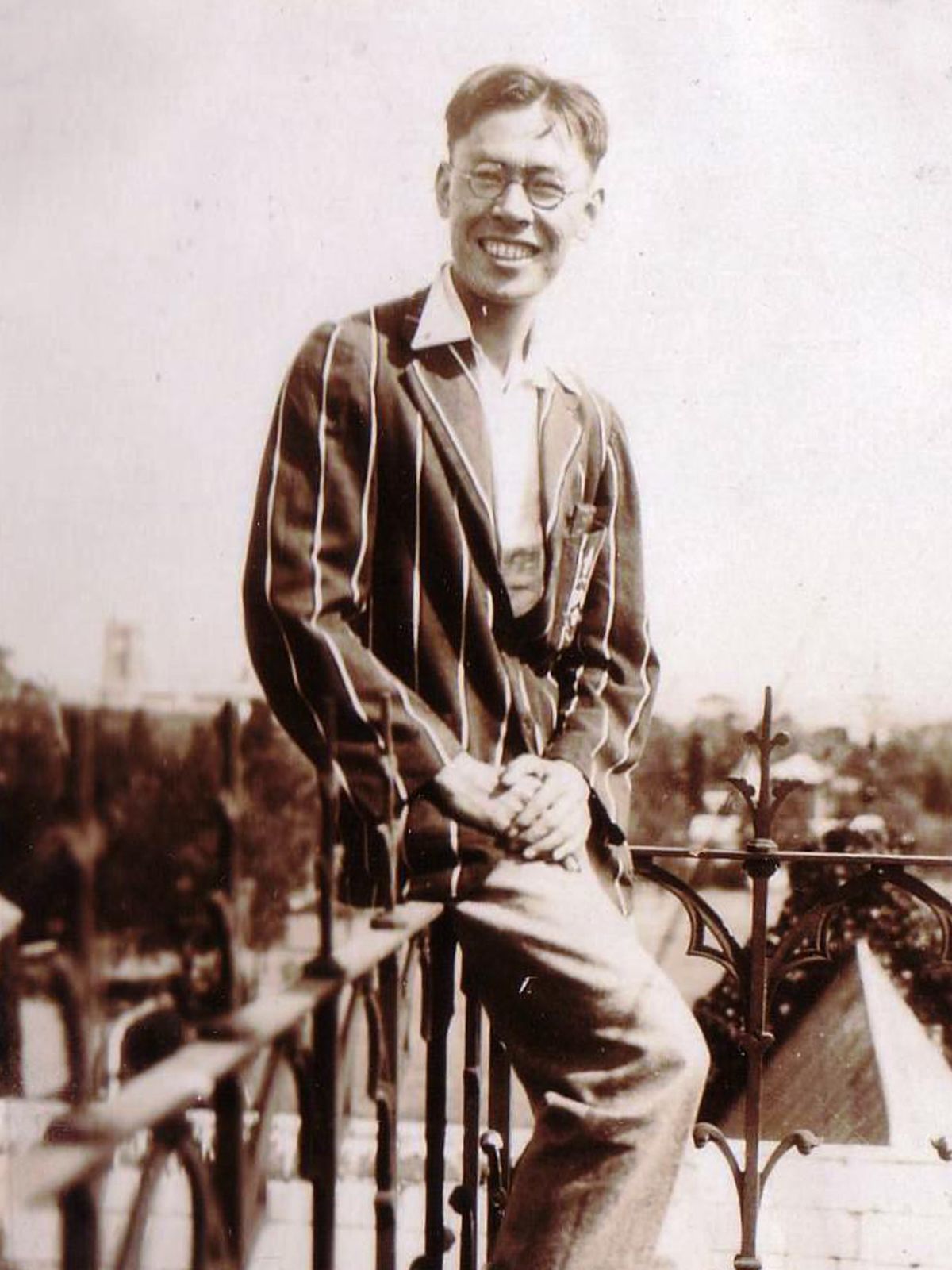 Queenslander Gilbert See Poy (TC 1925) takes in the view from atop Clarke Building, late 1920s.