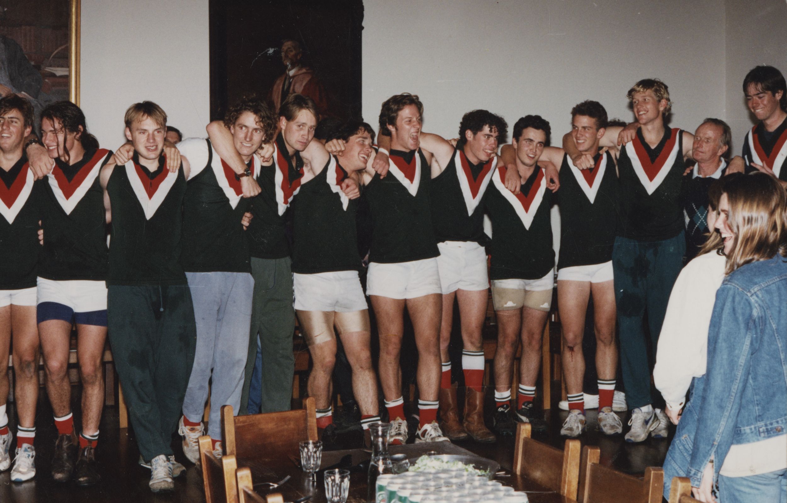 The men's football team celebrate their drought-breaking premiership win in the Dining Hall in 1994.
