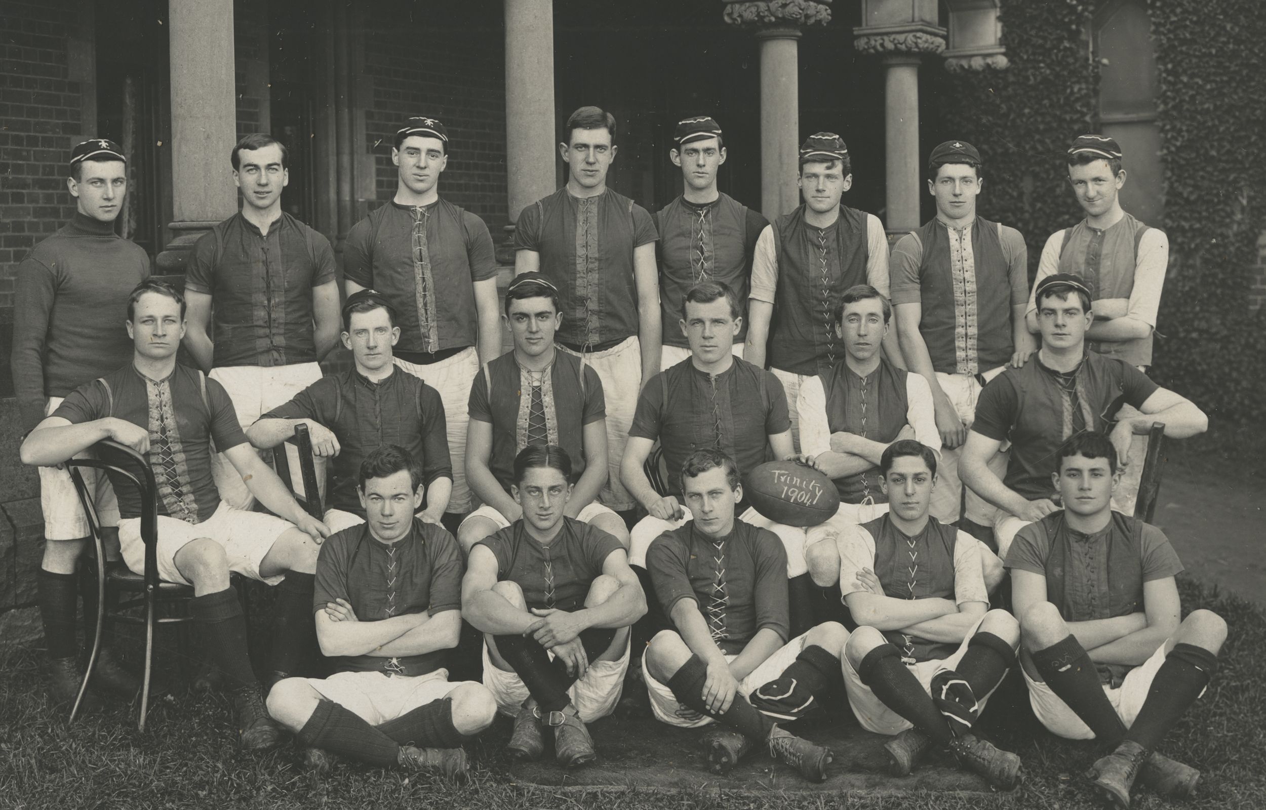 Trinity's Football Team modelling the latest sportswear in front of the Clarke Building cloisters in 1904.