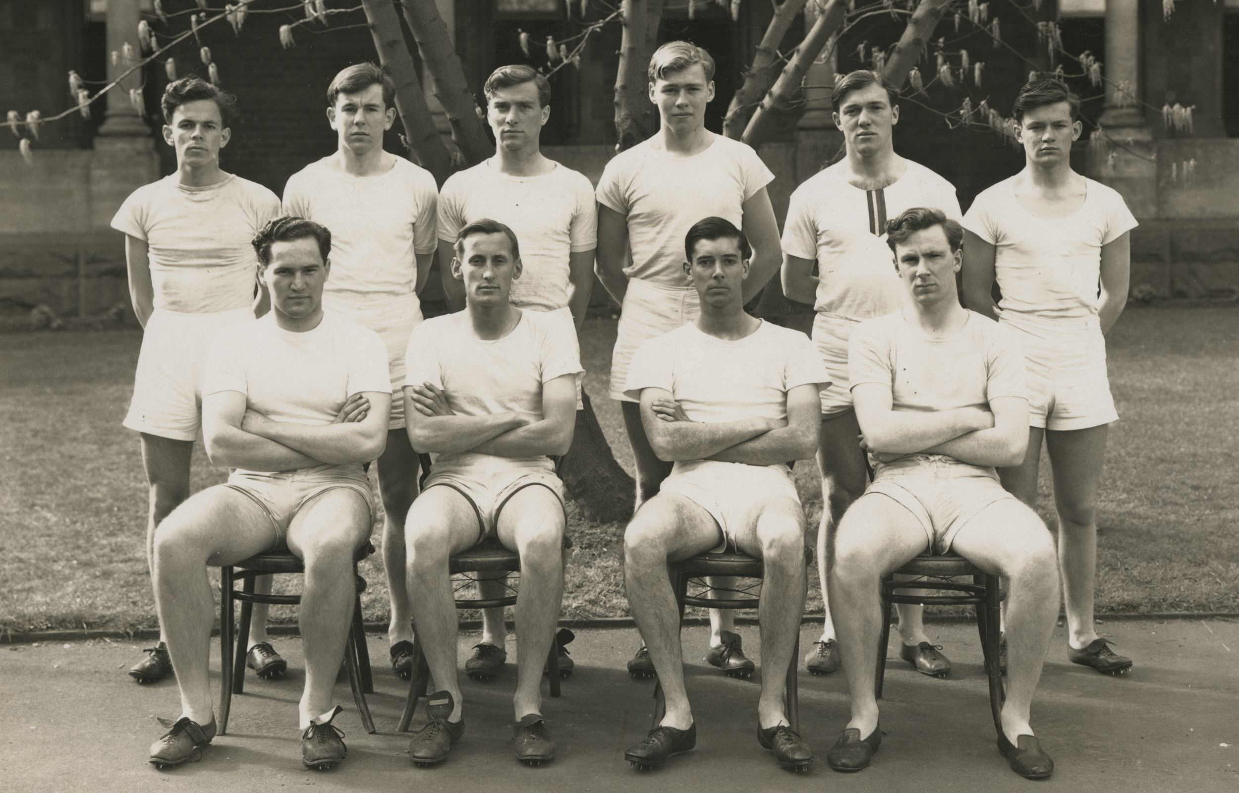The 1943 Athletics team enjoying some later afternoon sun in front of Clarke Building.