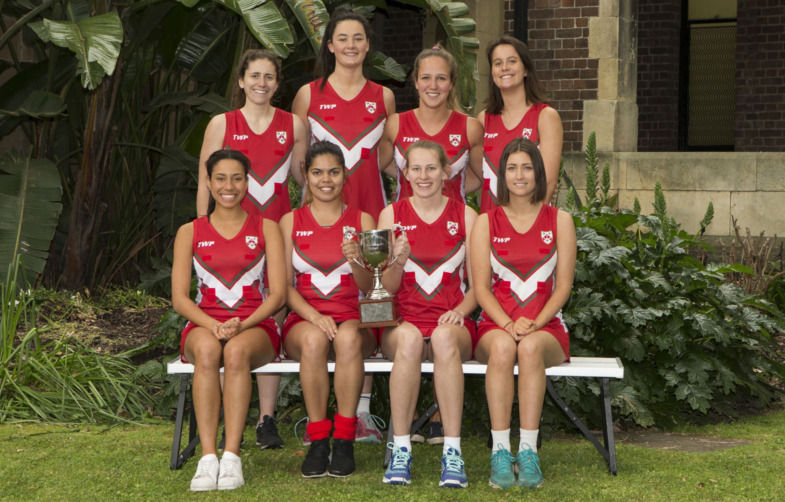 The 1st Netball Team of 2016 proudly hold up their trophy after a winning game.